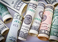 Banking sector icon with currency and building graphics